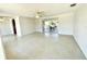 Bright living room with terrazzo flooring and access to the screened porch at 700 Dolphin Pkwy, Punta Gorda, FL 33950