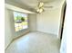 Well-lit room featuring terrazzo floors and a large window at 700 Dolphin Pkwy, Punta Gorda, FL 33950