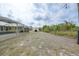 Spacious backyard with potential, featuring a shed and screened-in lanai with a pool at 7333 Watson Ln, Port Charlotte, FL 33981