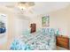 Inviting bedroom featuring ceiling fan, and coastal themed bedding at 7333 Watson Ln, Port Charlotte, FL 33981