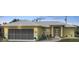 Delightful one-story house with metal roof, screened garage and a modern front door design at 7333 Watson Ln, Port Charlotte, FL 33981