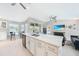 Bright, open-concept living space featuring a modern island kitchen and dining nook at 7333 Watson Ln, Port Charlotte, FL 33981