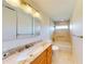 Bright bathroom with updated vanity, granite countertop, and tiled shower/tub combo at 745 Monaco Dr, Punta Gorda, FL 33950