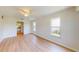 Bedroom features wood floors, a ceiling fan and two large windows at 745 Monaco Dr, Punta Gorda, FL 33950