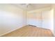 Bedroom features wood flooring, closet, and neutral paint at 745 Monaco Dr, Punta Gorda, FL 33950