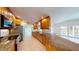 Open kitchen features wood cabinets, granite countertops, stainless steel appliances, and tile floors at 745 Monaco Dr, Punta Gorda, FL 33950