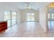 Open-concept living area with sliding glass doors leading to an outdoor pool area at 745 Monaco Dr, Punta Gorda, FL 33950