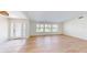 Bright living room with wood flooring, large windows, and natural light at 745 Monaco Dr, Punta Gorda, FL 33950