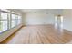 Bright living room with wood flooring, large windows, and an open layout at 745 Monaco Dr, Punta Gorda, FL 33950