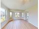 Bright living room with wood floors, bay window and views of the pool at 745 Monaco Dr, Punta Gorda, FL 33950
