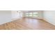 Bright living room with wood flooring, large windows, and a neutral color scheme at 745 Monaco Dr, Punta Gorda, FL 33950