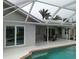 Outdoor living area, patio, and screened-in pool at 745 Monaco Dr, Punta Gorda, FL 33950