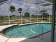 Screened-in pool with golf course view at 745 Monaco Dr, Punta Gorda, FL 33950