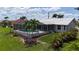 Enjoy a private screened-in pool area, surrounded by lush landscaping and an expansive outdoor patio at 745 Monaco Dr, Punta Gorda, FL 33950
