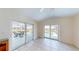 Bright sunroom with tile floors and sliding doors to the pool area and screened patio at 745 Monaco Dr, Punta Gorda, FL 33950