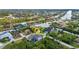 Aerial shot showcasing the waterfront property and neighborhood with canal access at 9239 Impala Cir, Port Charlotte, FL 33981