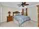 Bedroom featuring neutral walls, carpeted floor, ceiling fan and warm lighting at 9239 Impala Cir, Port Charlotte, FL 33981