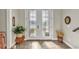 Elegant foyer showcases decorative glass doors, tile flooring, and lush greenery at 9239 Impala Cir, Port Charlotte, FL 33981