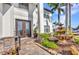 Close up of an inviting home entrance, featuring double doors and decorative stone accents at 9239 Impala Cir, Port Charlotte, FL 33981