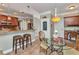 Eat-in kitchen features breakfast bar seating, decorative lighting, and adjacent breakfast table at 9239 Impala Cir, Port Charlotte, FL 33981