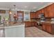 Traditional kitchen featuring granite countertops, stainless steel appliances, and wood cabinetry at 9239 Impala Cir, Port Charlotte, FL 33981