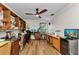 Home office with hardwood floors, built in shelving, and a ceiling fan at 9239 Impala Cir, Port Charlotte, FL 33981