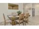 Dining table features decor and seating for six at 10995 Pinot Dr, Venice, FL 34293