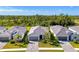 Beautiful new home with modern design, paver driveway, and lush landscaping at 10995 Pinot Dr, Venice, FL 34293