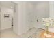 Open foyer features clean lines, tile floors, neutral colors, and leads to other areas of the home at 10995 Pinot Dr, Venice, FL 34293