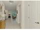Bright foyer with a view through to the living room and lanai through the sliding glass doors at 10995 Pinot Dr, Venice, FL 34293