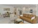 Bright living space featuring modern decor, connecting the dining room and kitchen at 10995 Pinot Dr, Venice, FL 34293