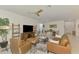 Spacious living area featuring modern furniture and a wall-mounted television at 10995 Pinot Dr, Venice, FL 34293