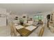 Open-concept living space with dining and kitchen at 10995 Pinot Dr, Venice, FL 34293