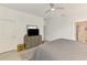 Bright main bedroom featuring ceiling fan, neutral paint, window with blinds, gray accents, and walk-in closet at 10995 Pinot Dr, Venice, FL 34293
