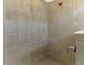 Modern shower with neutral tile, clear glass partition, and updated fixtures for a spa-like experience at 10995 Pinot Dr, Venice, FL 34293