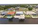A beautiful aerial view of the neighborhood with several homes, docks and boat lifts at 12596 Bacchus Rd, Port Charlotte, FL 33981
