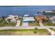 An aerial view showcases the property's prime waterfront location and access to the open water at 12596 Bacchus Rd, Port Charlotte, FL 33981