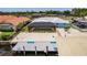 An aerial view of the property featuring a covered pool, boat dock, and RV parking at 12596 Bacchus Rd, Port Charlotte, FL 33981