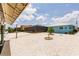 A view of the backyard and screened pool of the home from the dock at 12596 Bacchus Rd, Port Charlotte, FL 33981