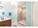 Modern bathroom featuring a double vanity, towel bar, and beautiful tiled shower at 12596 Bacchus Rd, Port Charlotte, FL 33981