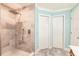 This bathroom has an open shower with a rainfall shower head and a tiled surround at 12596 Bacchus Rd, Port Charlotte, FL 33981