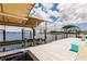 Boat dock with boat lift and view of the waterfront home at 12596 Bacchus Rd, Port Charlotte, FL 33981