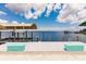 Wide angle shot of dock with boat lift and water view at 12596 Bacchus Rd, Port Charlotte, FL 33981