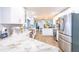 Open kitchen featuring white cabinets, stainless appliances and granite counters at 12596 Bacchus Rd, Port Charlotte, FL 33981