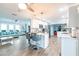 Bright, open kitchen flows into the living area, featuring bar seating and modern appliances at 12596 Bacchus Rd, Port Charlotte, FL 33981