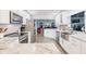 Clean, modern kitchen with stainless steel appliances and bright white cabinetry at 12596 Bacchus Rd, Port Charlotte, FL 33981