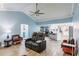 Open concept living room showing kitchen with breakfast bar and comfortable seating at 12596 Bacchus Rd, Port Charlotte, FL 33981