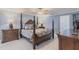 Bedroom featuring a decorative bed, lamps and ensuite bathroom at 12596 Bacchus Rd, Port Charlotte, FL 33981