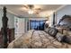 Bedroom featuring a decorative bed, lamps and a view of the pool at 12596 Bacchus Rd, Port Charlotte, FL 33981