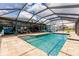 An inviting, screened pool and expansive outdoor living space at 12596 Bacchus Rd, Port Charlotte, FL 33981